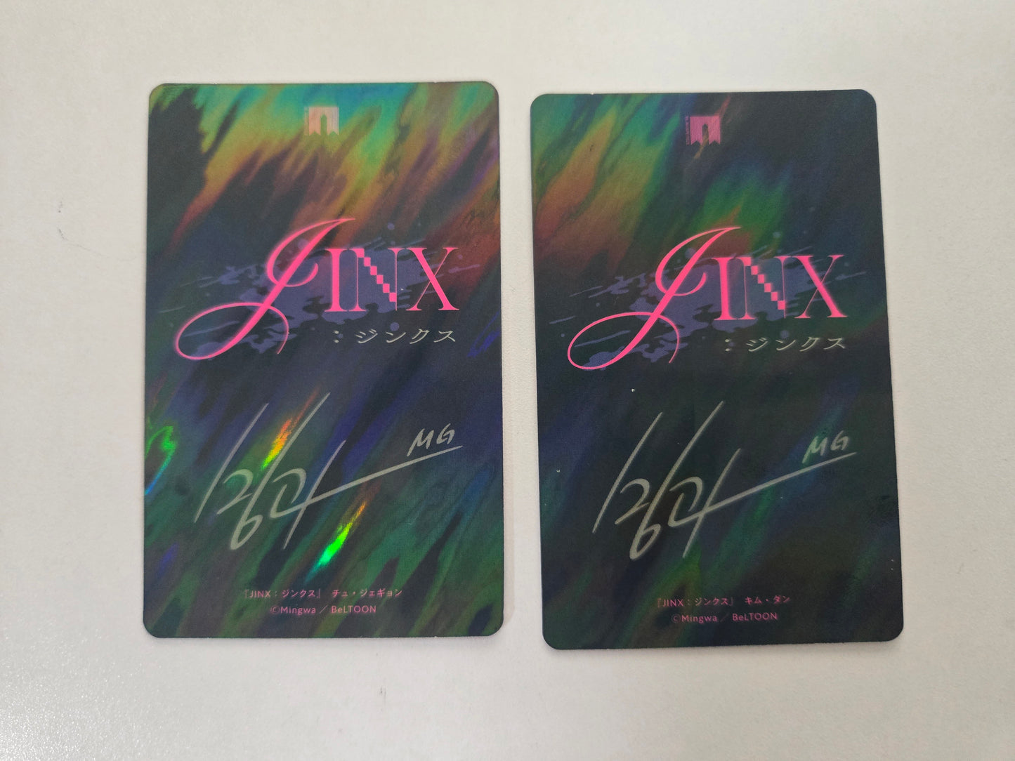 Two colorful cards with 'JINX' branding on a white background