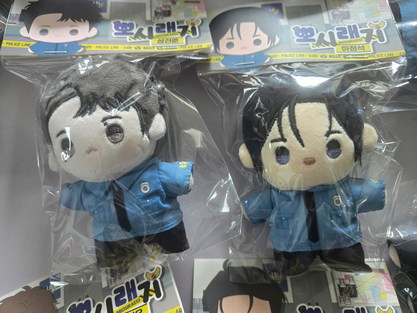 1to10 plush dolls in retail packaging, featuring Jungseok and Gunjoon