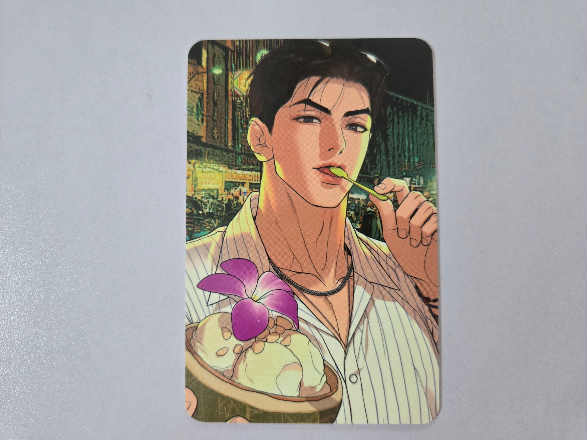 Illustration of Joo Jaekyung eating ice cream with a cityscape background 