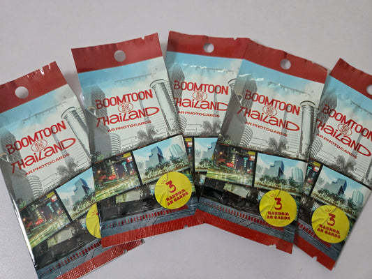 Packets of Boomtoon Thailand air photobooks on a white background
