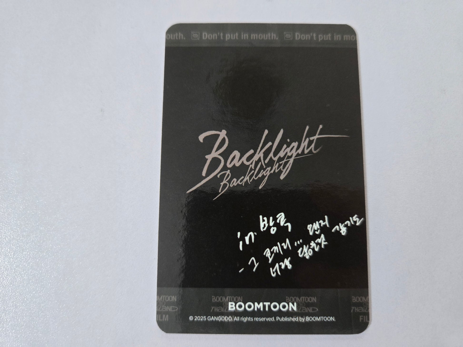 Black card with 'Backlight' text and 'BOOMTOON' branding on a white background