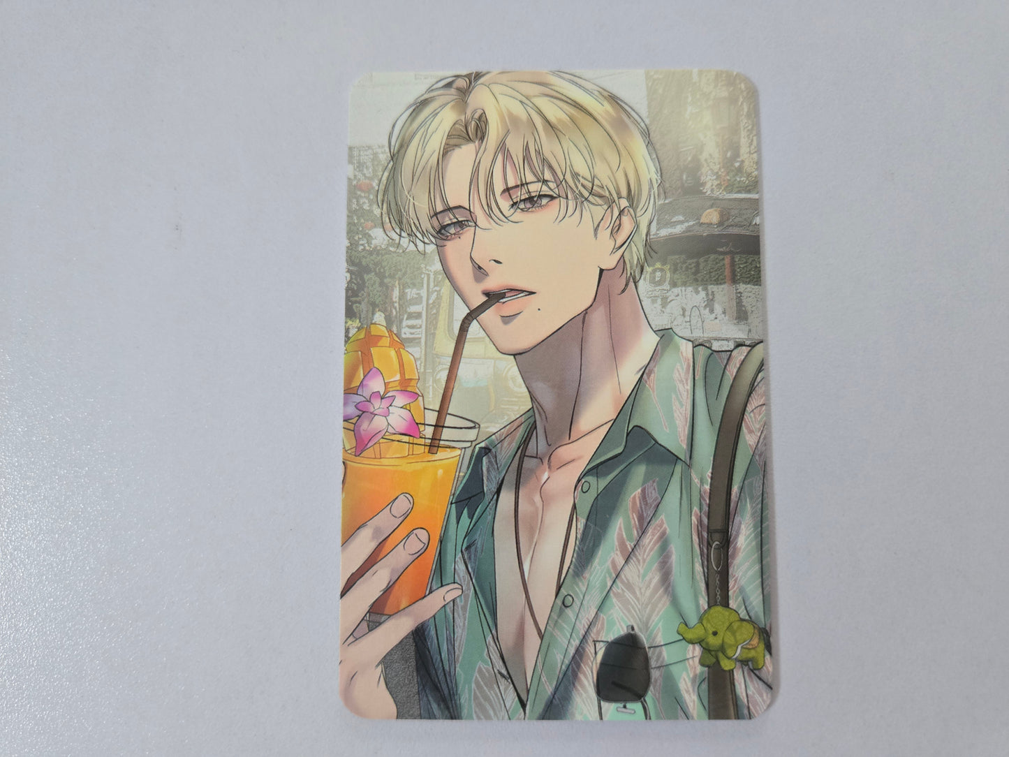 Illustration of Han Seoin holding a drink with a straw on a light gray background
