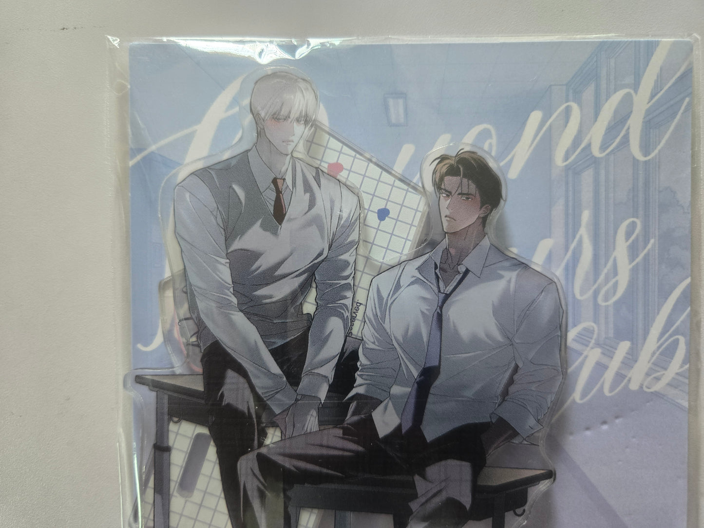 Codename Anastasia standee featuring Taekjoo and Zhenya in uniforms and dark trousers