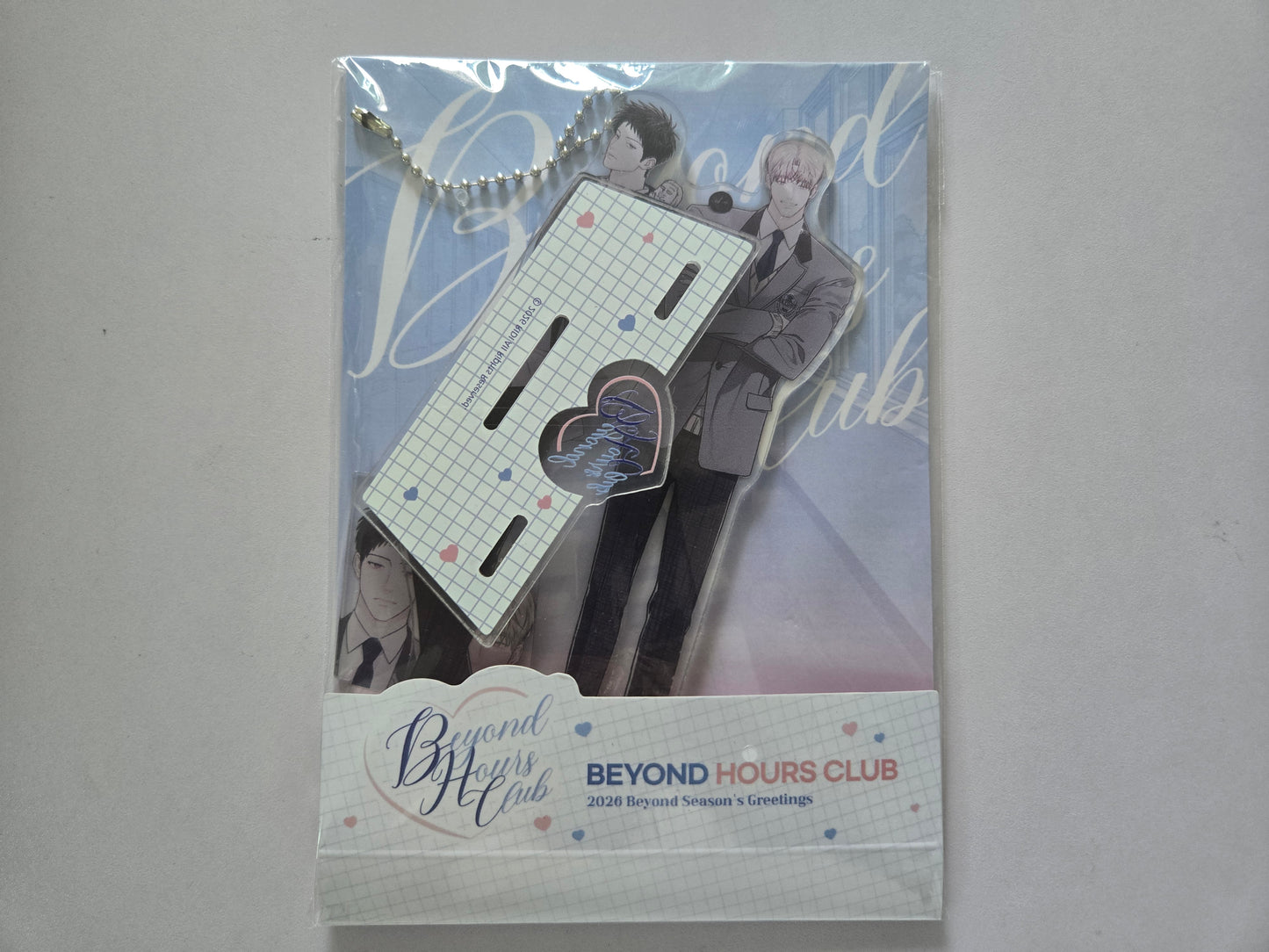 A packaged acrylic stand and keychain from Beyond Hours Club featuring Juheon and Dohu