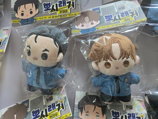 Jinx plush dolls in retail packaging, featuring Kim Dan and Jaekyung 