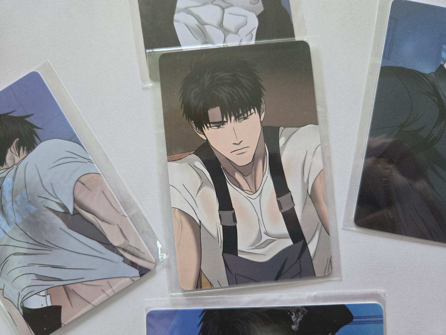 Shingun in a white shirt and black suspenders.