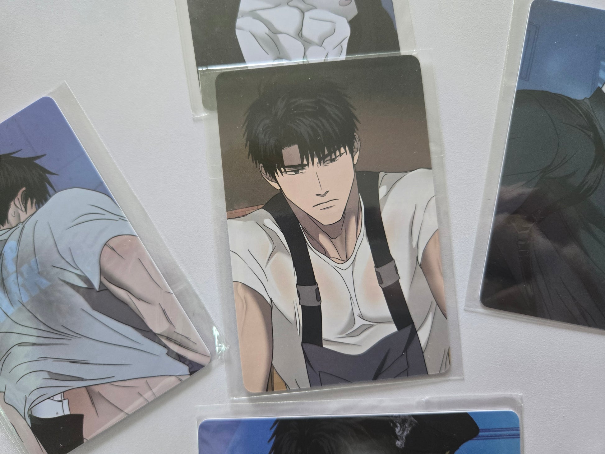 Shingun in a white shirt and black suspenders.