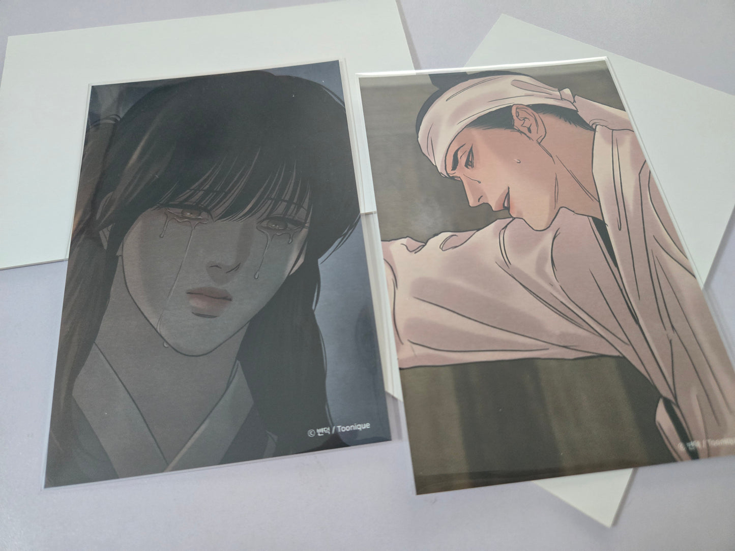Painter of the night characters illustrations, placed on top of white envelopes against a light gray background.