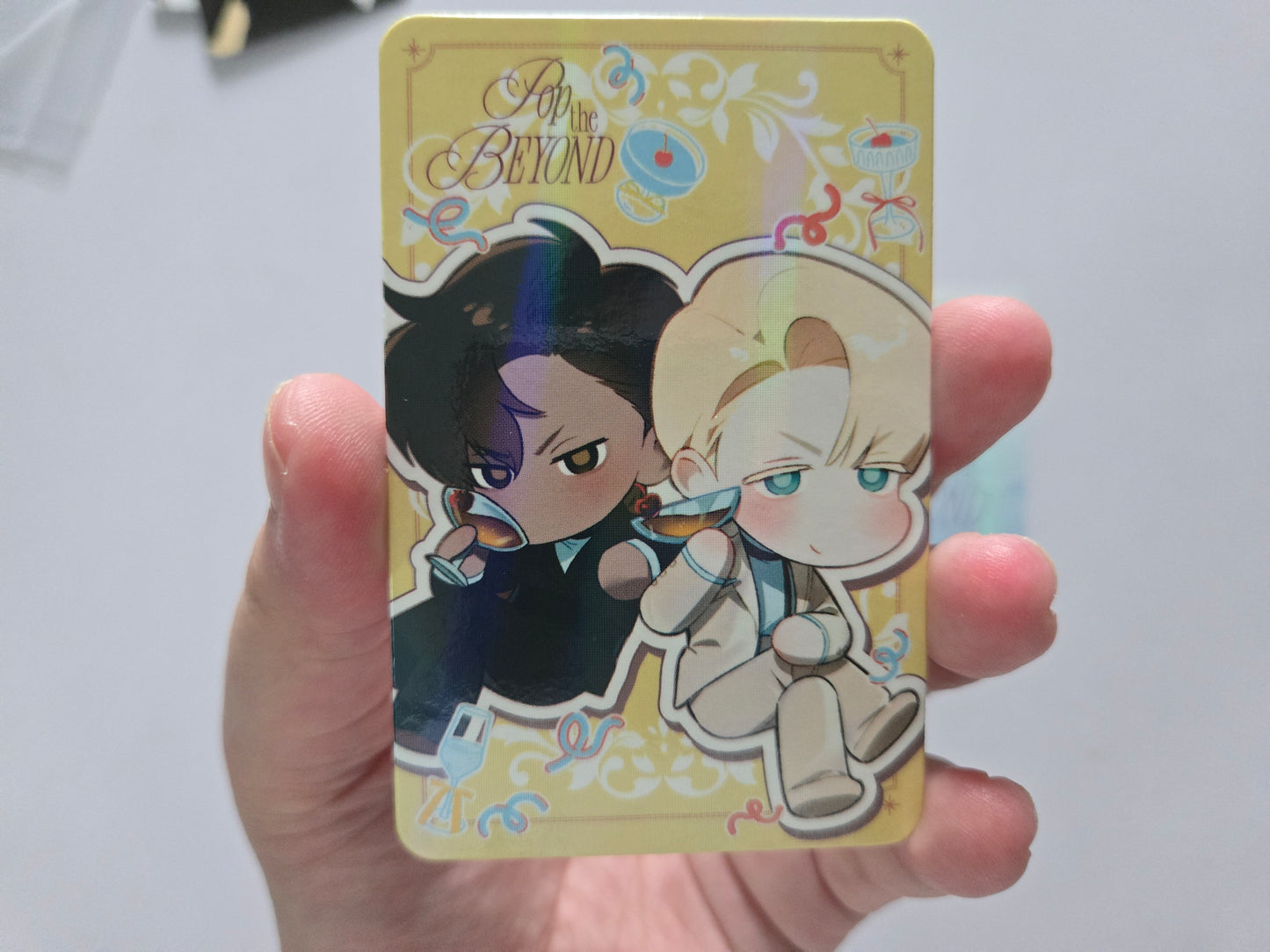 Collectible card featuring Codename anastasia characters and the text 'After the BEYOND' at the top. The card has a pale yellow background with decorative floral and swirl motifs.