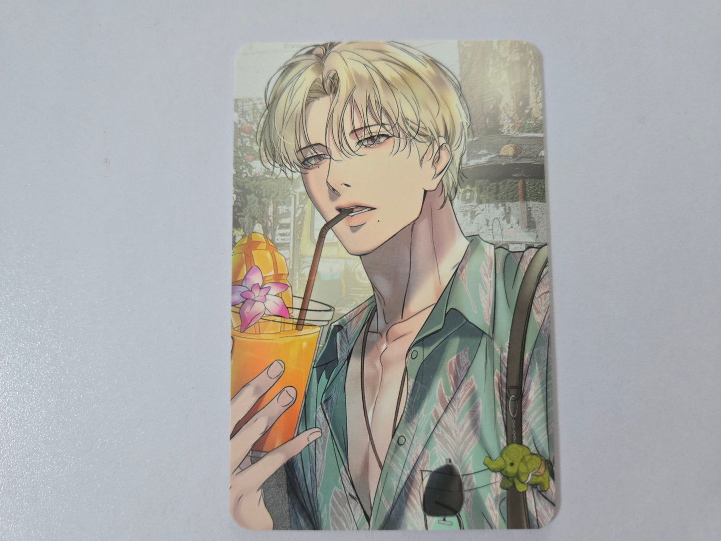 Illustration card of Han Seoin holding a drink
