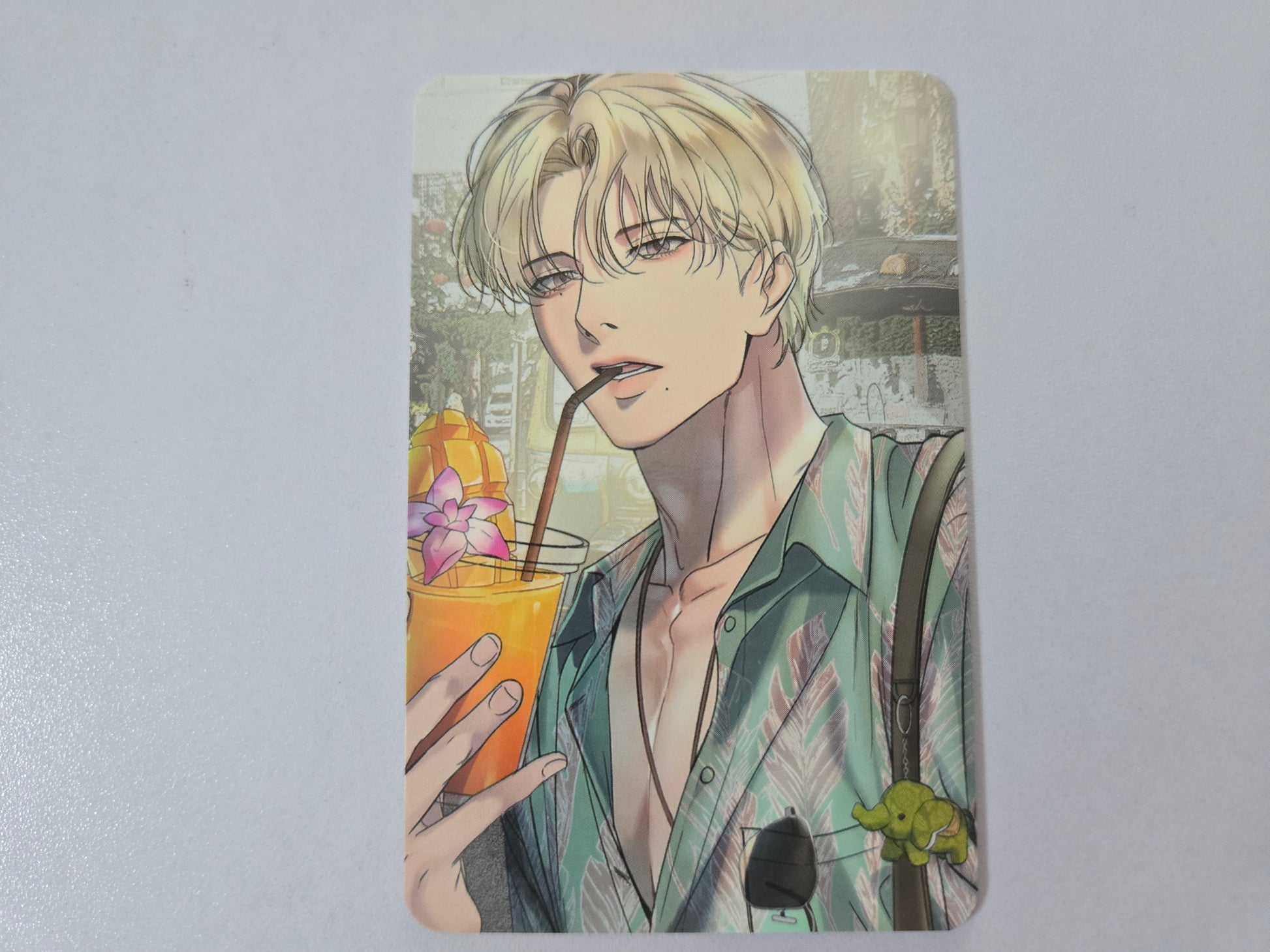 Illustration card of Han Seoin holding a drink