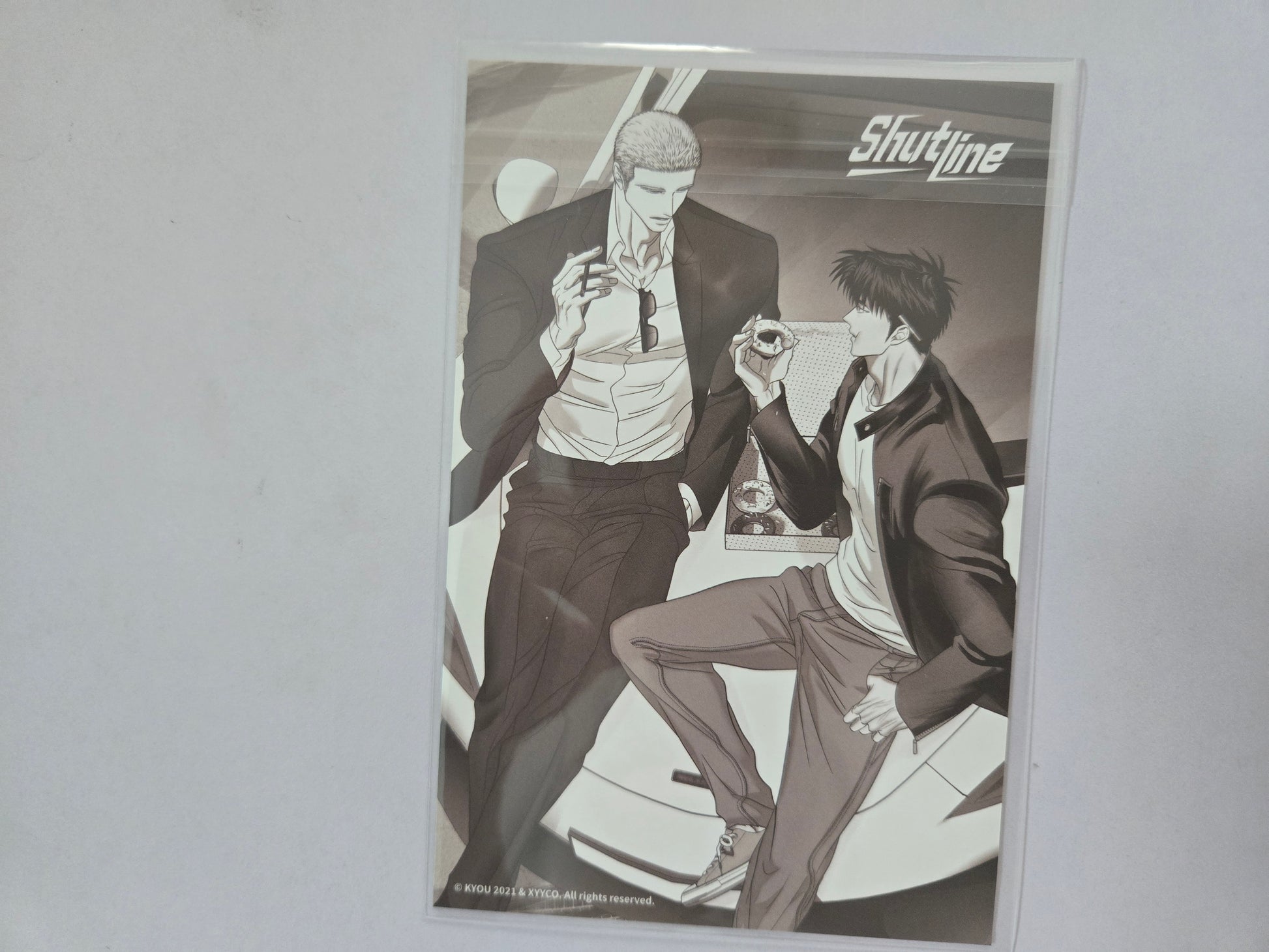 Jake and Shin in suits sitting next to each other with 'Shutline' branding.
