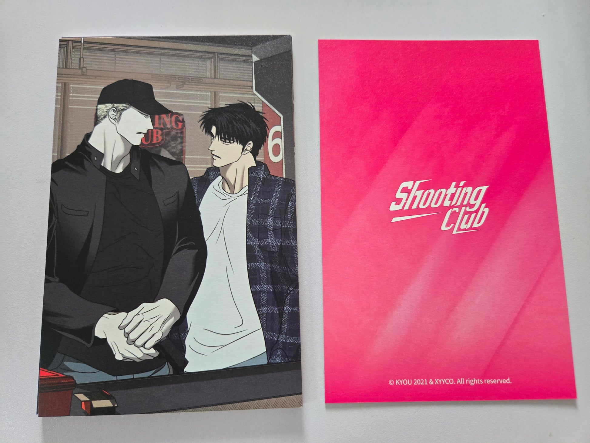 Shutline characters and a pink 'Shooting Club' card on a white background