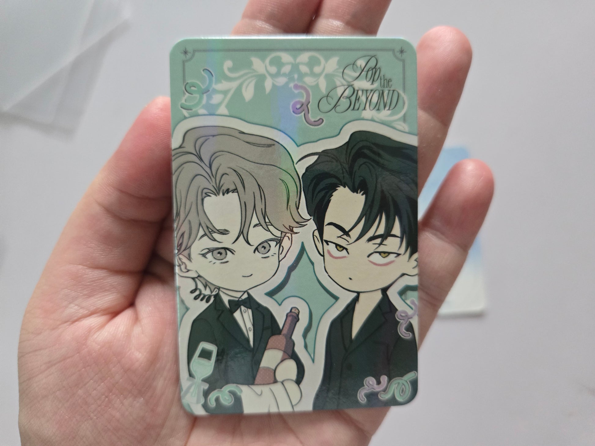 Collectible card featuring Woo-won Seo-an with the text 'Pop the BEYOND' at the top. The card has a pale mint background with black, gray, and white line art and small iridescent shimmer near the top right.
