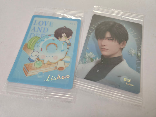 Two sealed Zayne cards in clear plastic bags. 