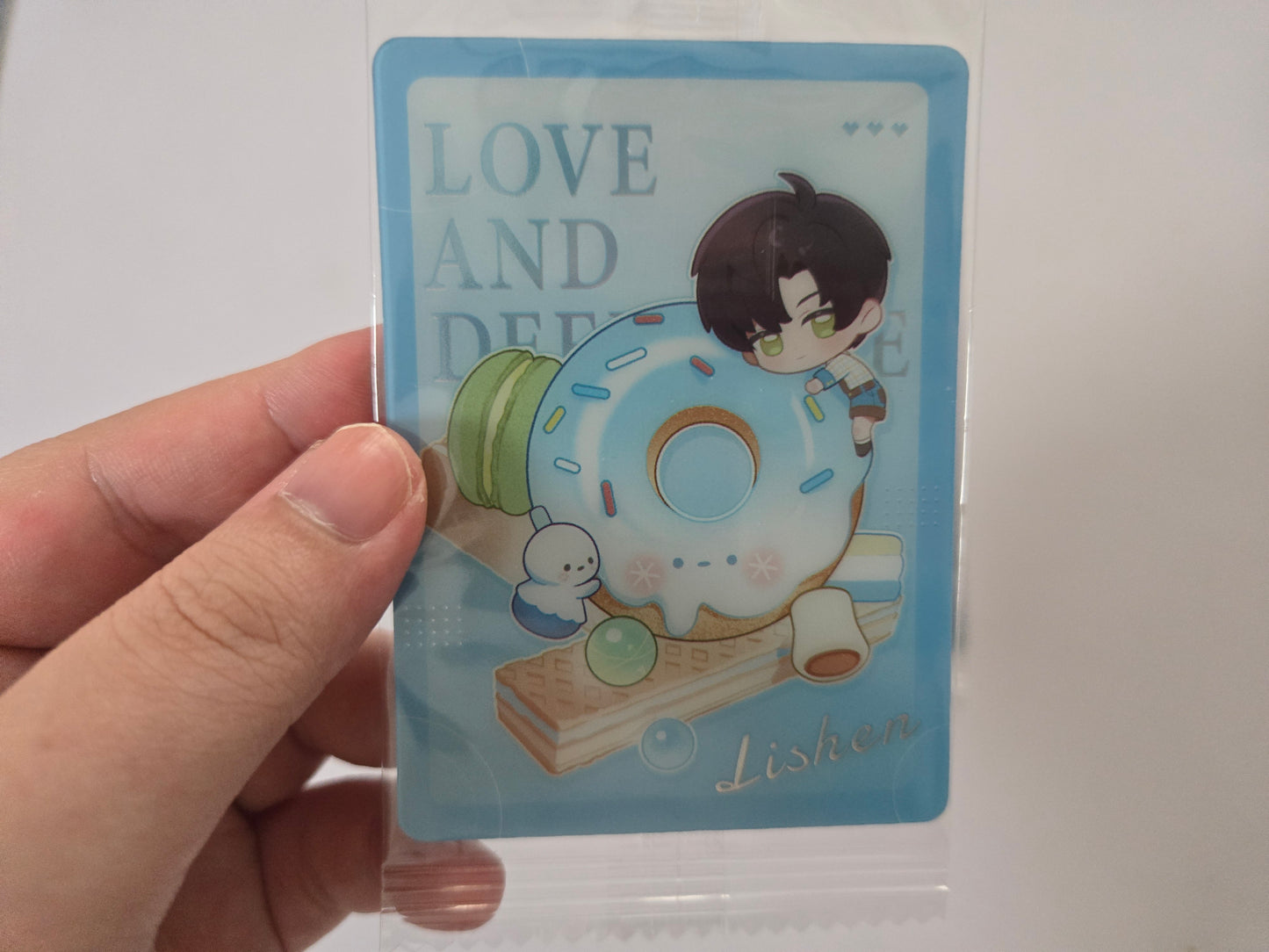 square blue card with Zayne illustrated character beside a donut and the text LOVE AND DEEPSPACE